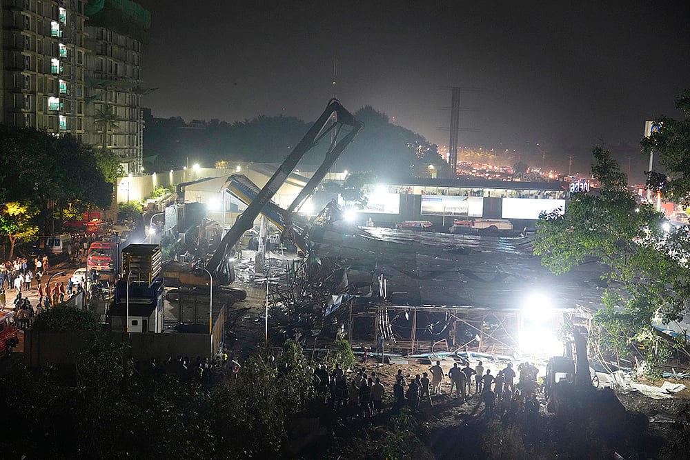 File Photo  : Rescue operation after Mumbai billboard collapse |